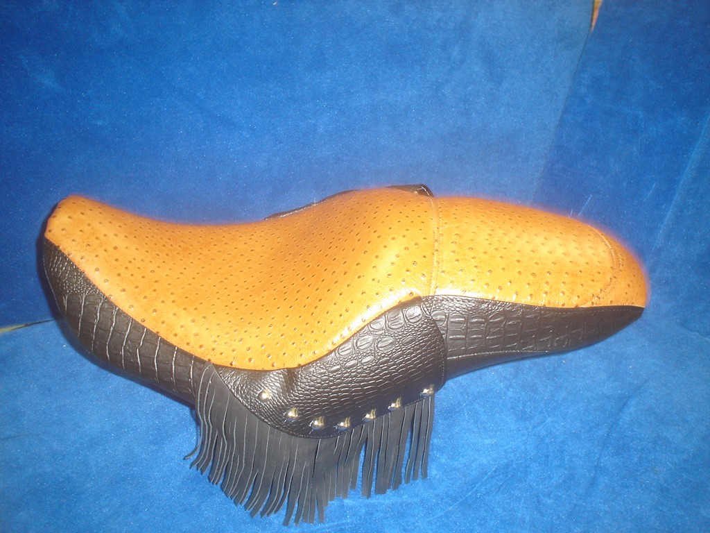 Two-up seat in tan ostrich with a black skirt and fringe
