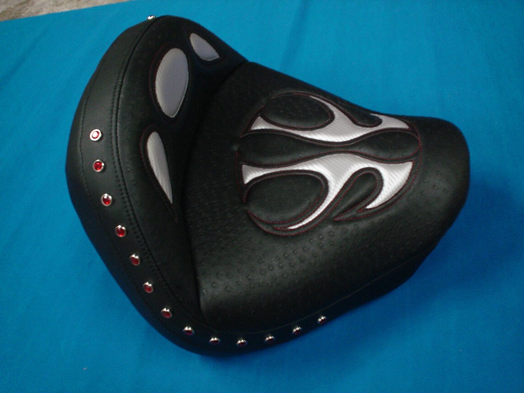 Solo black seat with silver flame inlays and red studs